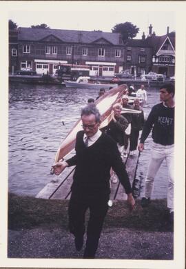 Photograph of Percy Bullock Helping to Carry a Boat