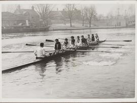 Photograph of Crew Rowing Past E & W Cawston Steam Launch Builders