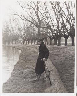 Photograph of Percy Bullock leaning on his Bicycle