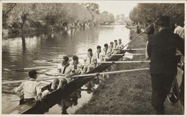 Photograph of a Crew Sitting in a Boat