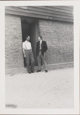 Photograph of Two Men Talking
