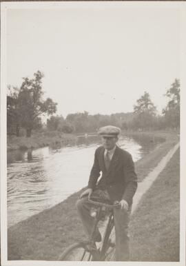 Photograph of Percy Bullock Riding his Bicycle along the Riverbank