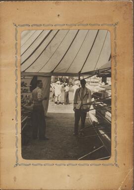 Photograph of Two Crew Members Inside a Tent