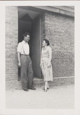 Photograph of a Man and Woman Talking