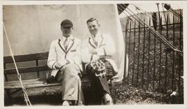 Sepia Photograph of Two Men on a Bench