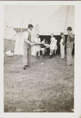 Photograph of a Crew carrying a Boat
